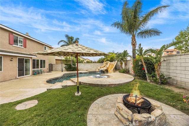 view of yard with a fenced backyard, a fenced in pool, an outdoor fire pit, and a patio