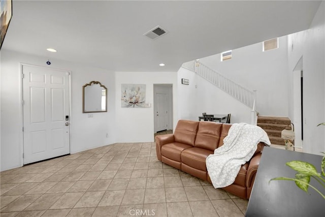 living room with visible vents, stairway, light tile patterned flooring, and recessed lighting