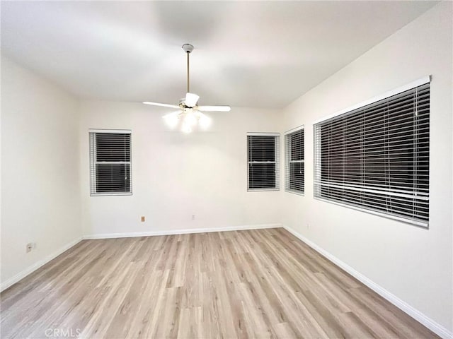 22810 Mountain Ash Cir, Corona, CA 92883 - empty room featuring baseboards, ceiling fan, and light wood-style floors