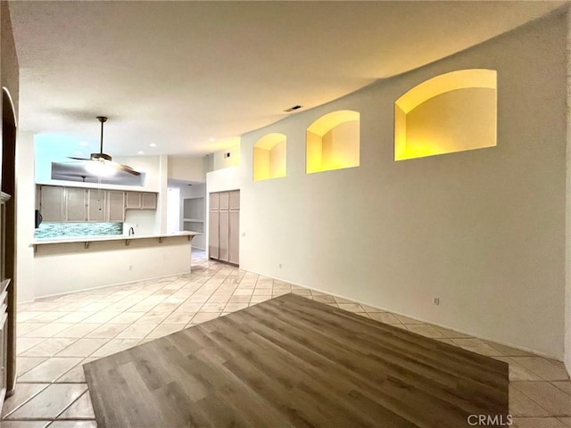 22810 Mountain Ash Cir, Corona, CA 92883 - unfurnished living room with light tile patterned floors, recessed lighting, and a ceiling fan