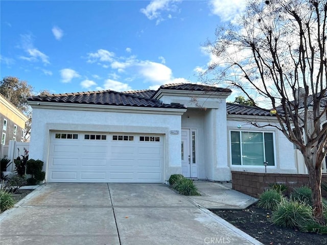 22810 Mountain Ash Cir, Corona, CA 92883 - view of front of property featuring driveway, a tiled roof, stucco siding, and a garage