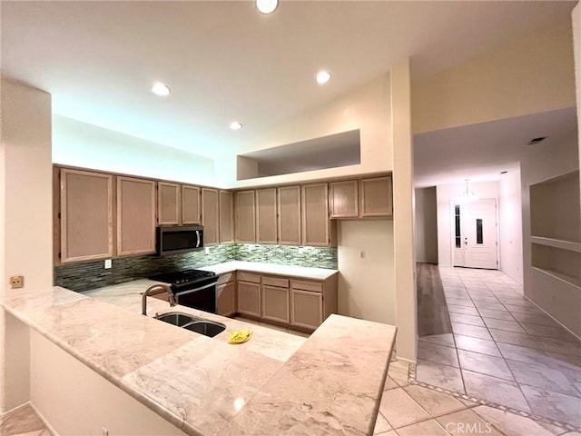 22810 Mountain Ash Cir, Corona, CA 92883 - kitchen featuring light tile patterned floors, stainless steel microwave, tasteful backsplash, a sink, and light countertops