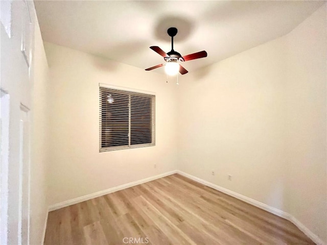 22810 Mountain Ash Cir, Corona, CA 92883 - empty room with baseboards, a ceiling fan, and light wood finished floors