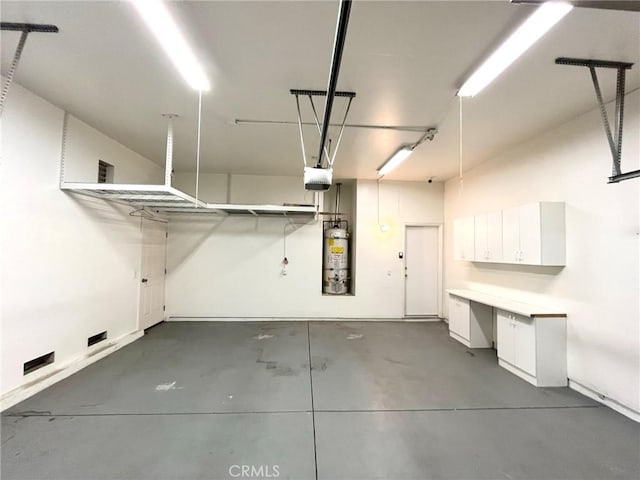 22810 Mountain Ash Cir, Corona, CA 92883 - garage featuring a garage door opener and secured water heater