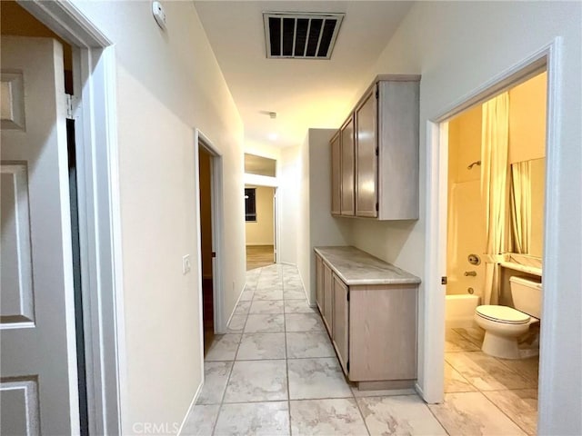22810 Mountain Ash Cir, Corona, CA 92883 - hallway featuring marble finish floor and visible vents