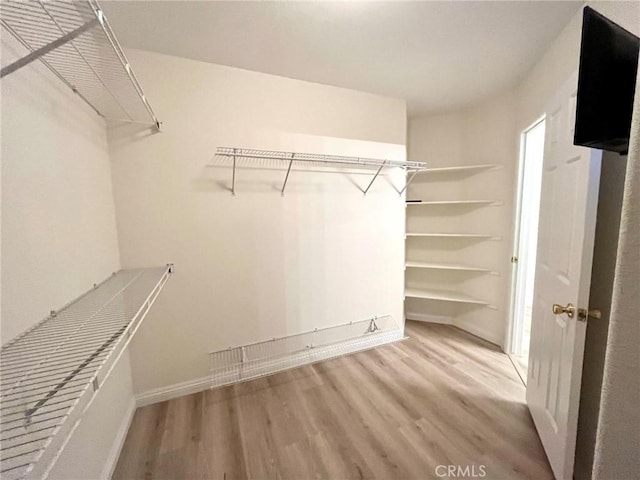 22810 Mountain Ash Cir, Corona, CA 92883 - spacious closet featuring wood finished floors