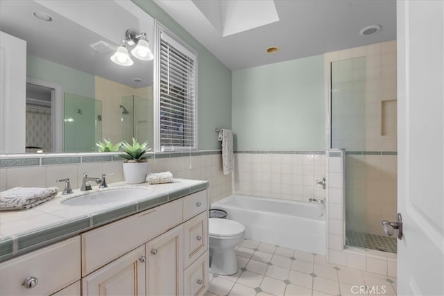 12 Bowie Rd, Rolling Hills, CA 90274 - bathroom with vanity, a garden tub, a shower stall, and a skylight