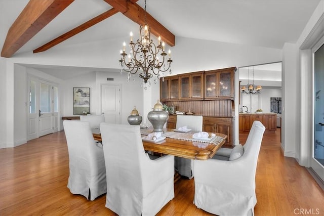 12 Bowie Rd, Rolling Hills, CA 90274 - dining area featuring a chandelier, light wood-style floors, and baseboards