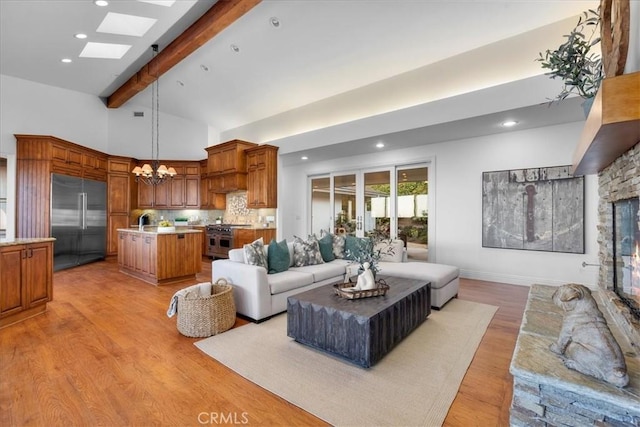 12 Bowie Rd, Rolling Hills, CA 90274 - living area with light wood finished floors, beamed ceiling, a chandelier, recessed lighting, and high vaulted ceiling