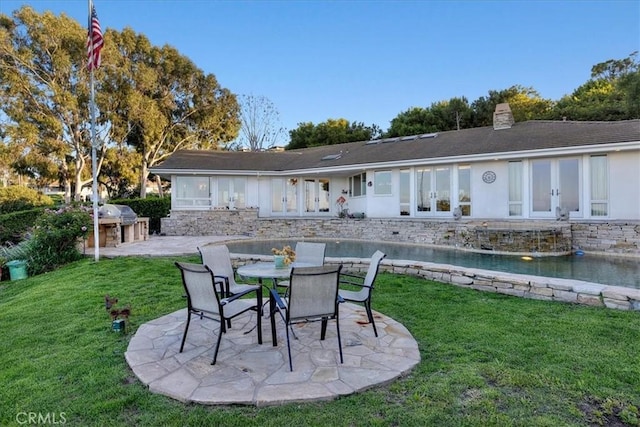 12 Bowie Rd, Rolling Hills, CA 90274 - rear view of house with a patio area, a chimney, a lawn, and french doors