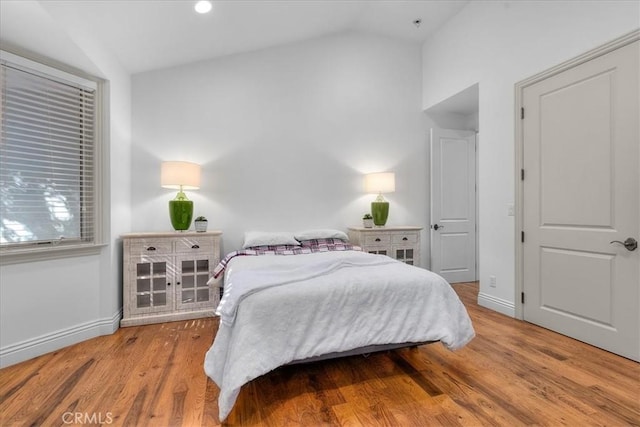 12 Bowie Rd, Rolling Hills, CA 90274 - bedroom featuring vaulted ceiling, baseboards, and wood finished floors