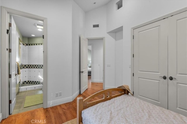 12 Bowie Rd, Rolling Hills, CA 90274 - bedroom with a closet, light wood finished floors, and connected bathroom