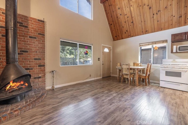 550 Pine Ln, Sugarloaf, CA 92386 - interior space with a towering ceiling, wood finished floors, plenty of natural light, and a wood stove