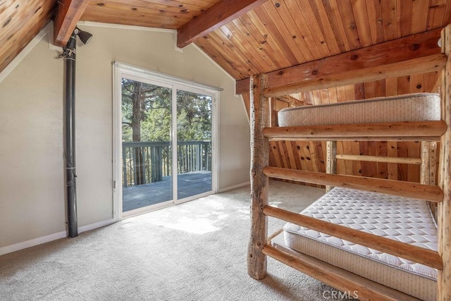 550 Pine Ln, Sugarloaf, CA 92386 - unfurnished bedroom with baseboards, access to exterior, carpet floors, and lofted ceiling with beams