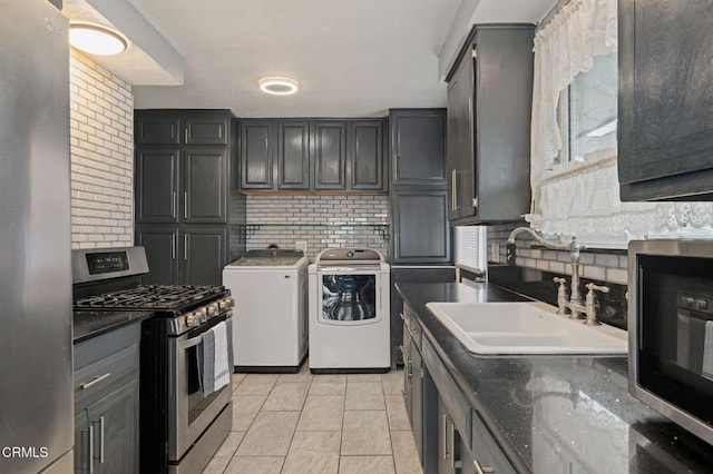 309 W Rosa St, Oxnard, CA 93033 - kitchen with tasteful backsplash, stainless steel appliances, a sink, and washing machine and dryer