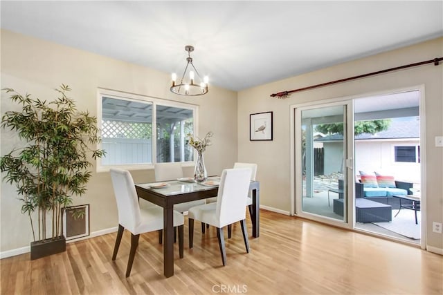 927 Alta Loma Dr, Corona, CA 92882 - dining space featuring light wood-style flooring and a chandelier