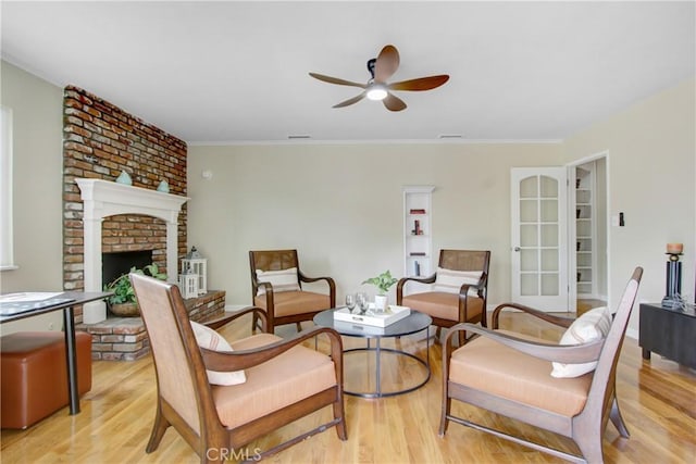 927 Alta Loma Dr, Corona, CA 92882 - living area with light wood finished floors, a ceiling fan, and a fireplace