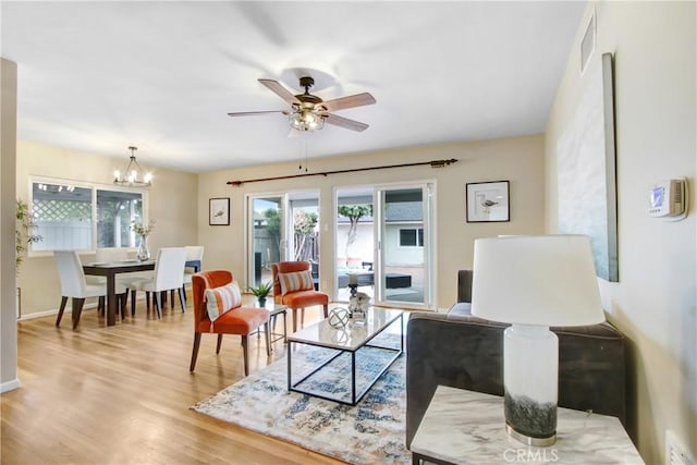 927 Alta Loma Dr, Corona, CA 92882 - living room with light wood-style floors, ceiling fan, and a chandelier