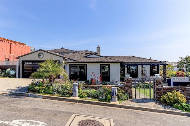812 8th St, Manhattan Beach, CA 90266 - view of front of house featuring a chimney, driveway, an attached garage, fence private yard, and a gate