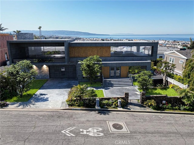 812 8th St, Manhattan Beach, CA 90266 - contemporary house with an attached garage, driveway, fence, and french doors