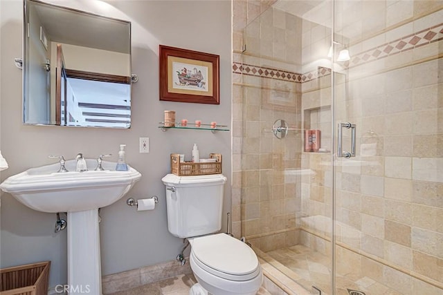 812 8th St, Manhattan Beach, CA 90266 - bathroom featuring toilet, baseboards, and a stall shower