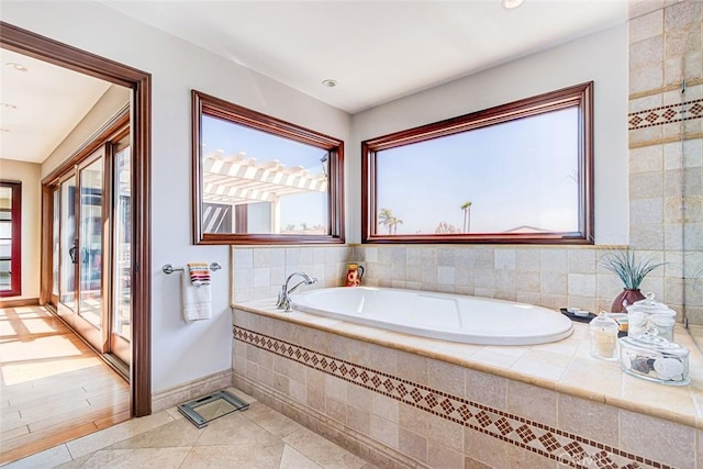 812 8th St, Manhattan Beach, CA 90266 - full bathroom featuring a garden tub, tile patterned flooring, baseboards, and a healthy amount of sunlight