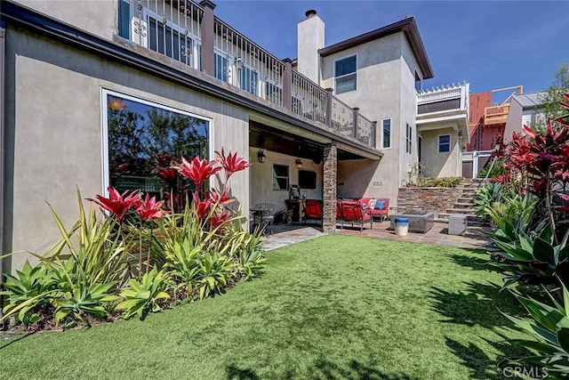 812 8th St, Manhattan Beach, CA 90266 - back of property featuring a patio area, stucco siding, and a lawn