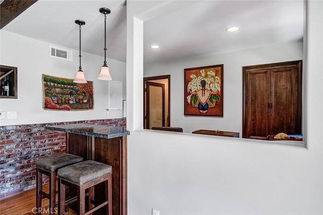 812 8th St, Manhattan Beach, CA 90266 - bar with wood finished floors, visible vents, recessed lighting, a bar, and hanging light fixtures