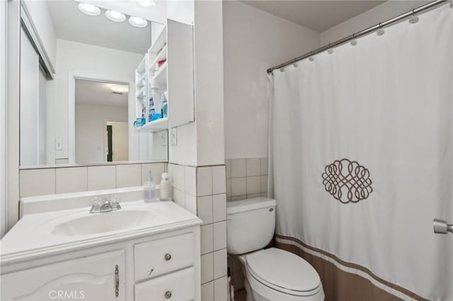 4447 Walnut Ave, Chino, CA 91710 - full bathroom with tile walls, toilet, and vanity