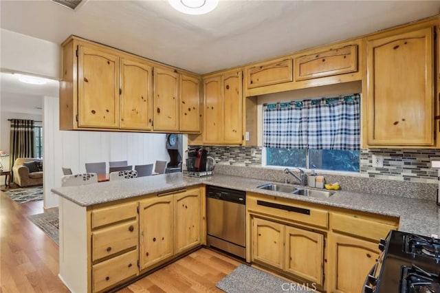 4447 Walnut Ave, Chino, CA 91710 - kitchen featuring light wood-style floors, dishwasher, a sink, black range with gas stovetop, and a peninsula