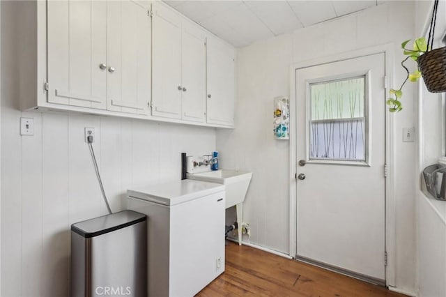 4447 Walnut Ave, Chino, CA 91710 - laundry room with wood finished floors