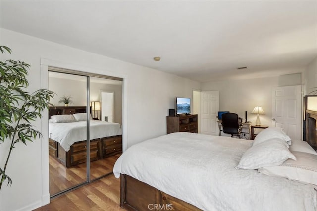 4447 Walnut Ave, Chino, CA 91710 - bedroom with a closet and wood finished floors
