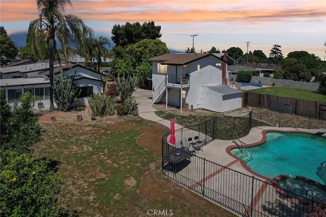 4447 Walnut Ave, Chino, CA 91710 - exterior space with stairs, a patio area, a lawn, a fenced backyard, and a pool with connected hot tub