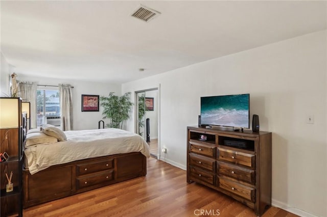 4447 Walnut Ave, Chino, CA 91710 - bedroom with baseboards, visible vents, and wood finished floors