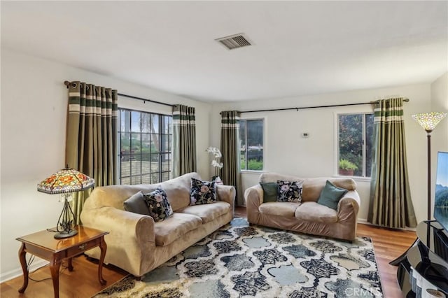 4447 Walnut Ave, Chino, CA 91710 - living room featuring visible vents and wood finished floors