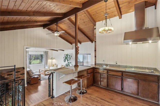 4447 Walnut Ave, Chino, CA 91710 - kitchen with stovetop, a sink, wood ceiling, island range hood, and wood finished floors