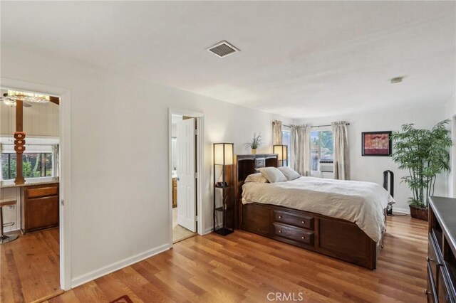 4447 Walnut Ave, Chino, CA 91710 - bedroom featuring visible vents, wood finished floors, and baseboards