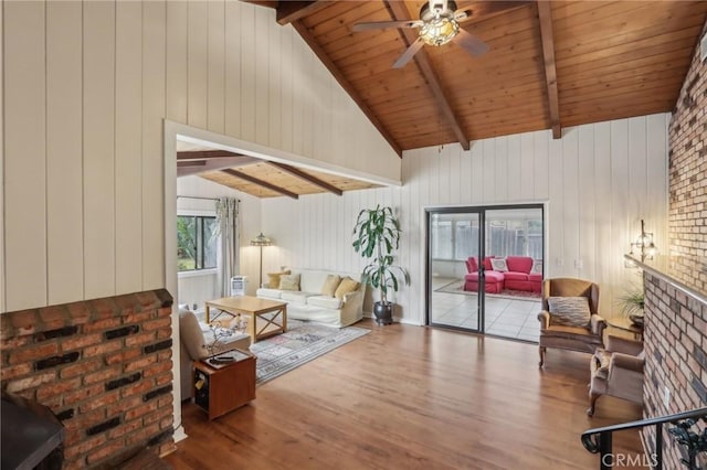 4447 Walnut Ave, Chino, CA 91710 - living room featuring wood ceiling, wood walls, ceiling fan, wood finished floors, and vaulted ceiling with beams