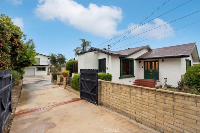 4447 Walnut Ave, Chino, CA 91710 - ranch-style home featuring stucco siding, a gate, and fence