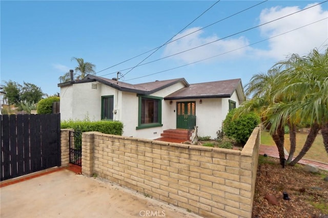 4447 Walnut Ave, Chino, CA 91710 - ranch-style home featuring stucco siding, fence, and a gate