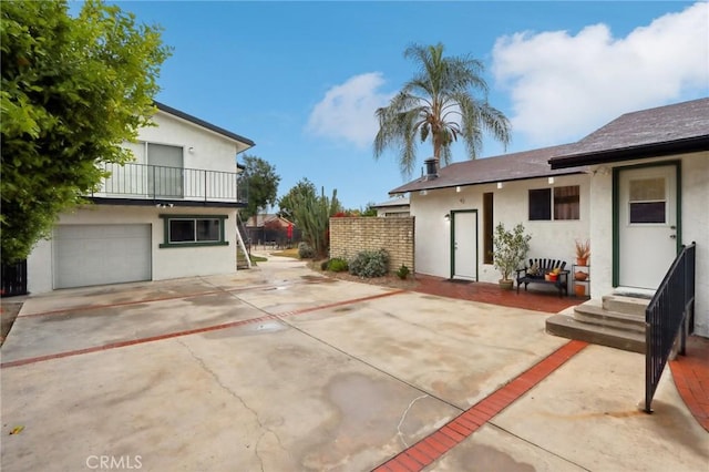 4447 Walnut Ave, Chino, CA 91710 - exterior space featuring fence, a balcony, and driveway