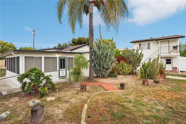 4447 Walnut Ave, Chino, CA 91710 - exterior space featuring stairway, stucco siding, and fence