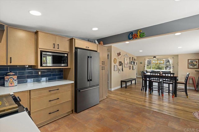 1576 Via Paloma, Escondido, CA 92026 - kitchen with appliances with stainless steel finishes, light brown cabinets, light countertops, decorative backsplash, and baseboards