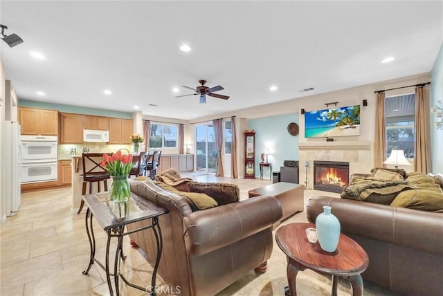 19069 Eldorado Rd, Perris, CA 92570 - living area featuring a tile fireplace, recessed lighting, and ceiling fan
