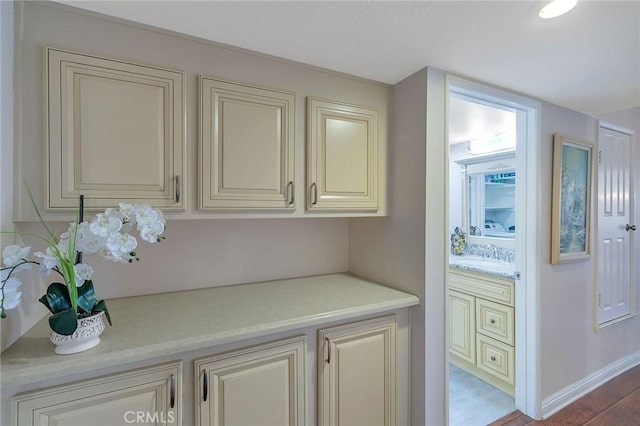 21650 Burbank Blvd Unit 111, Woodland Hills, CA 91367 - interior details featuring baseboards, wood finished floors, and a sink