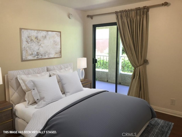 21650 Burbank Blvd Unit 111, Woodland Hills, CA 91367 - bedroom featuring baseboards, access to exterior, and dark wood-style flooring