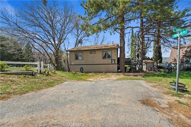view of front facade with stairs and fence