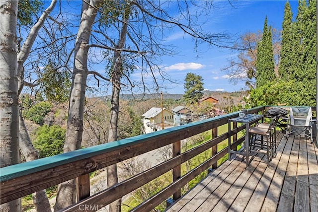 wooden deck featuring a mountain view