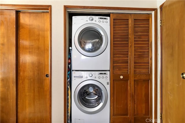 laundry area with stacked washer / dryer