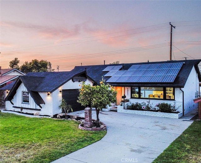 10057 Faywood, Bellflower, CA 90706 - ranch-style house featuring solar panels, driveway, roof with shingles, a front lawn, and an attached garage